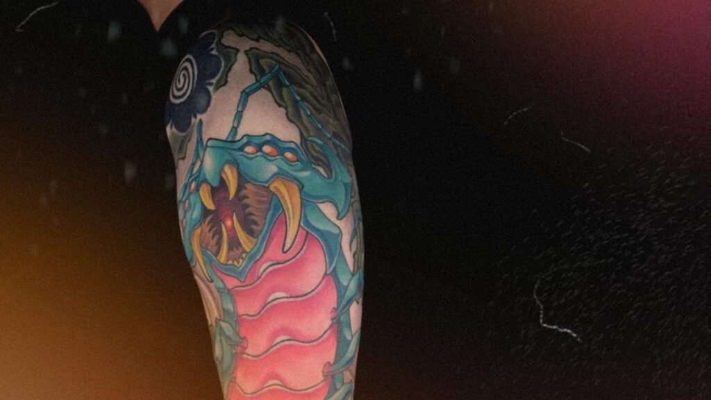 Japanese Mukade centipede arm sleeve tattoo with dynamic composition and intricate details, representing courage, protection, and unstoppable movement.