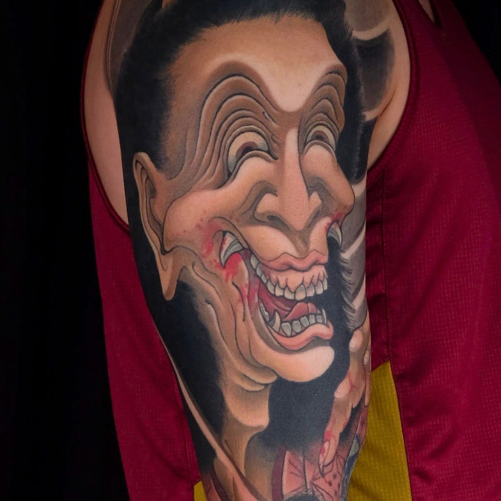 Japanese warai hannya laughing demon mask sleeve tattoo in black and grey by CK Tattoo Singapore