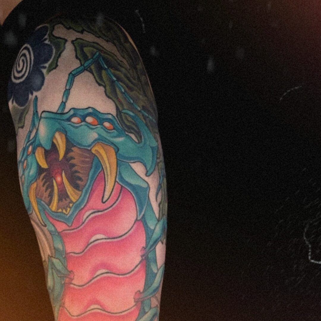 Japanese Mukade centipede arm sleeve tattoo with dynamic composition and intricate details, representing courage, protection, and unstoppable movement.
