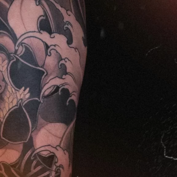 black-and-grey-lotus-leg-tattoo-cover