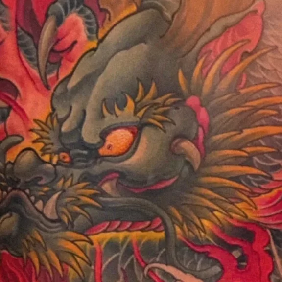 Japanese full back tattoo of a dragon surrounded by flames and waves, symbolizing power, courage, and spiritual transformation in Irezumi art.Japanese full back tattoo of a dragon surrounded by flames and waves, symbolizing power, courage, and spiritual transformation in Irezumi art.