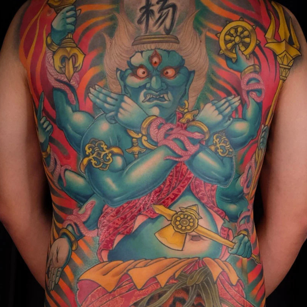 Gundari Myoo Japanese Buddhist wisdom king full back tattoo with snakes flames and sacred weapons by CK Tattoo Singapore