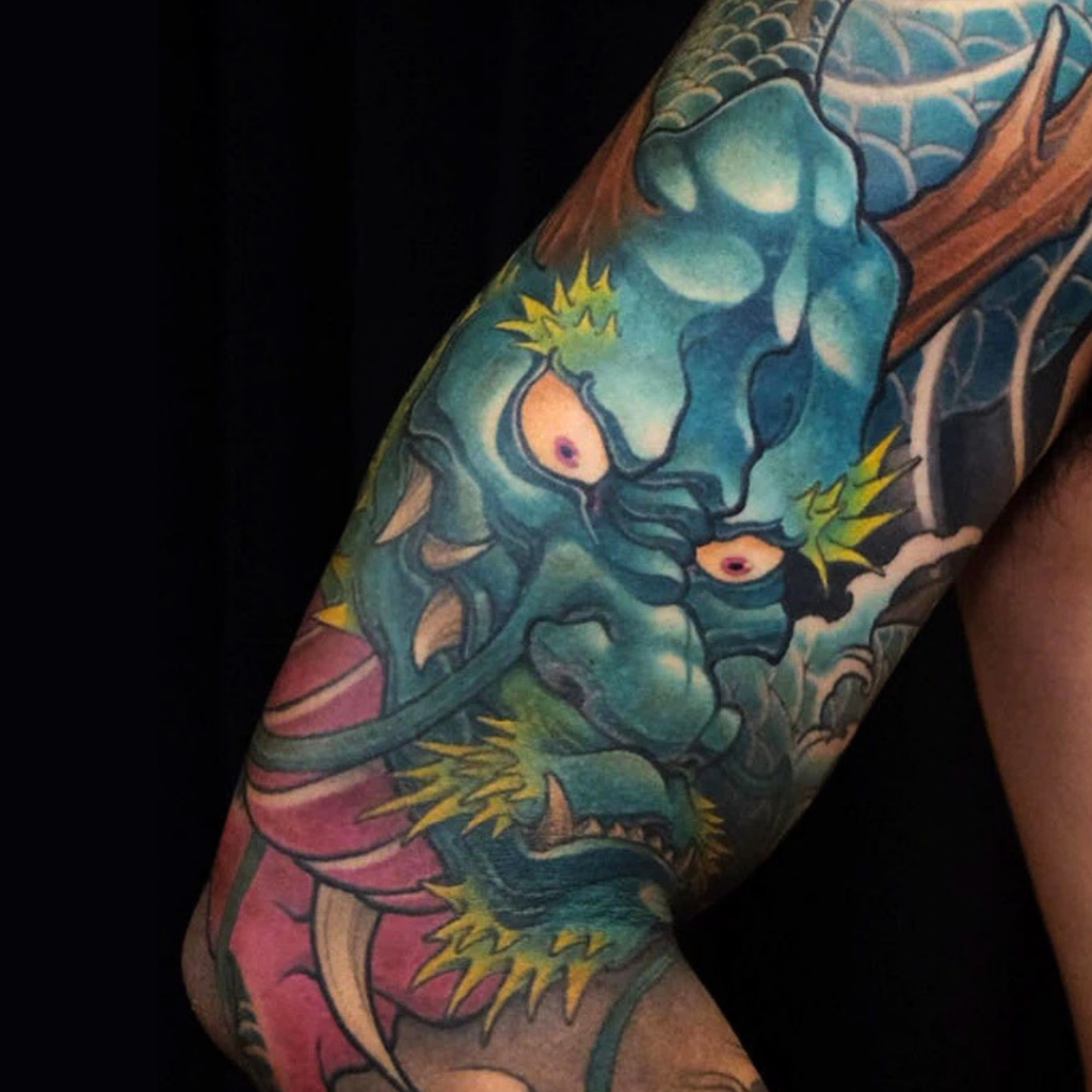 Japanese blue dragon full sleeve tattoo with waves chest panel and peonies by CK Tattoo Singapore
