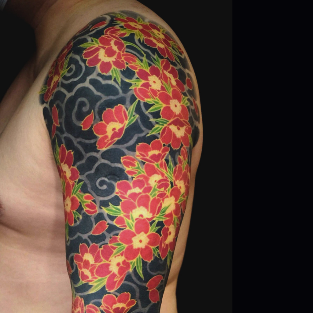 Japanese sakura cherry blossom sleeve tattoo on solid black background by CK Tattoo Singapore
