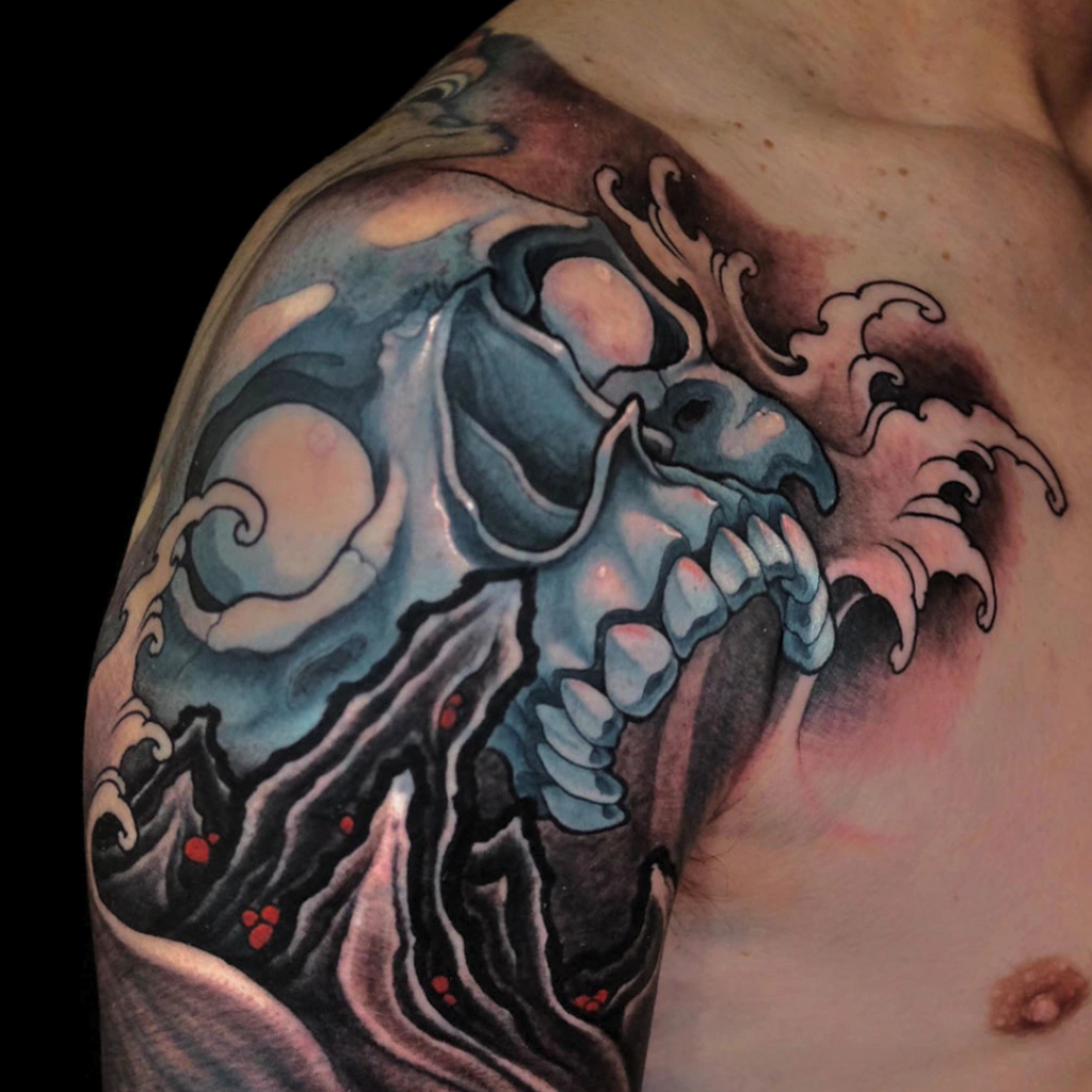 Japanese skull cover up sleeve tattoo with mountain landscape and waves by CK Tattoo Singapore
